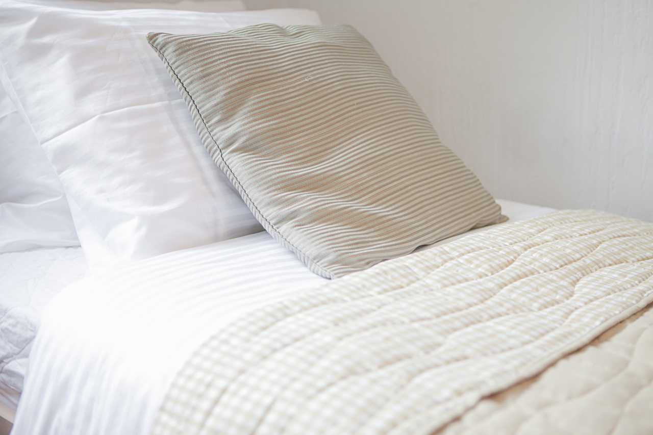 Apartment Downtown (Skadarlija, Belgrade) – made bed detail with pillows and throw