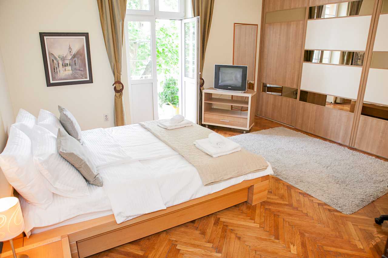 Apartment Downtown (Skadarlija, Belgrade) – bedroom with double bed, fitted wardrobe and terrace