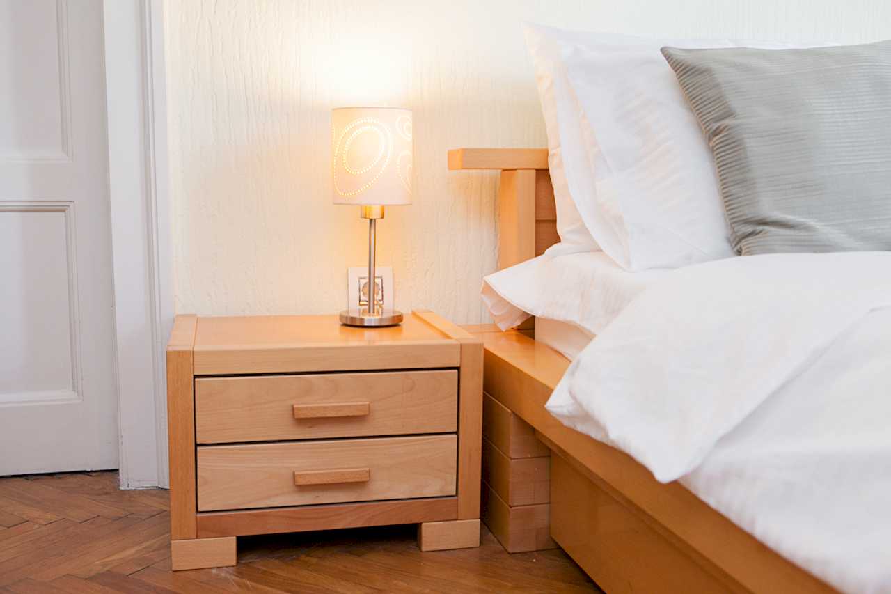 Apartment Downtown (Skadarlija, Belgrade) – nightstand with lamp and part of double bed