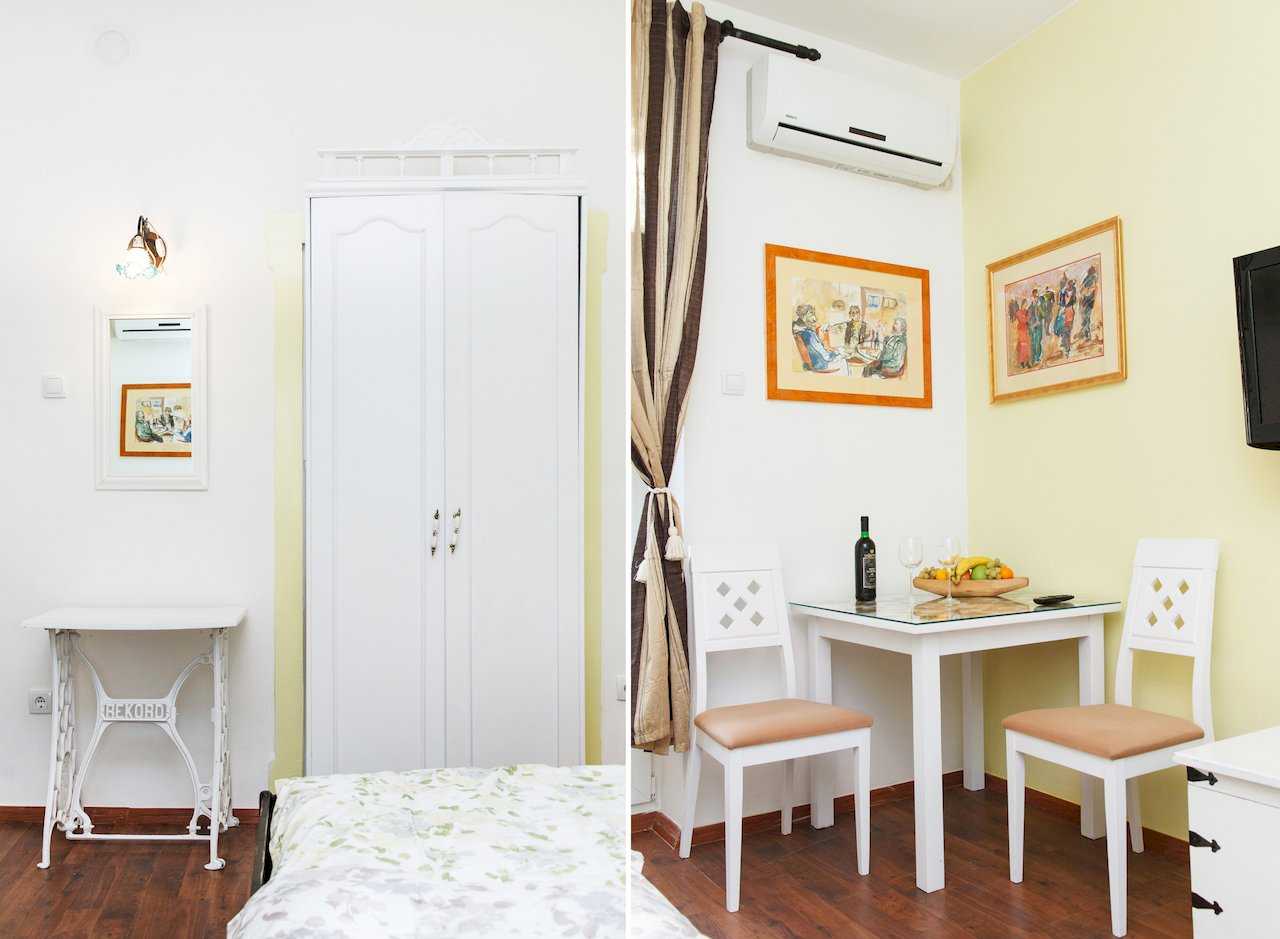 Apartman Sweet (Beograd, centar) – beli ormar i sto na šivaćoj mašini, trpezarijski kutak (dve fotografije)