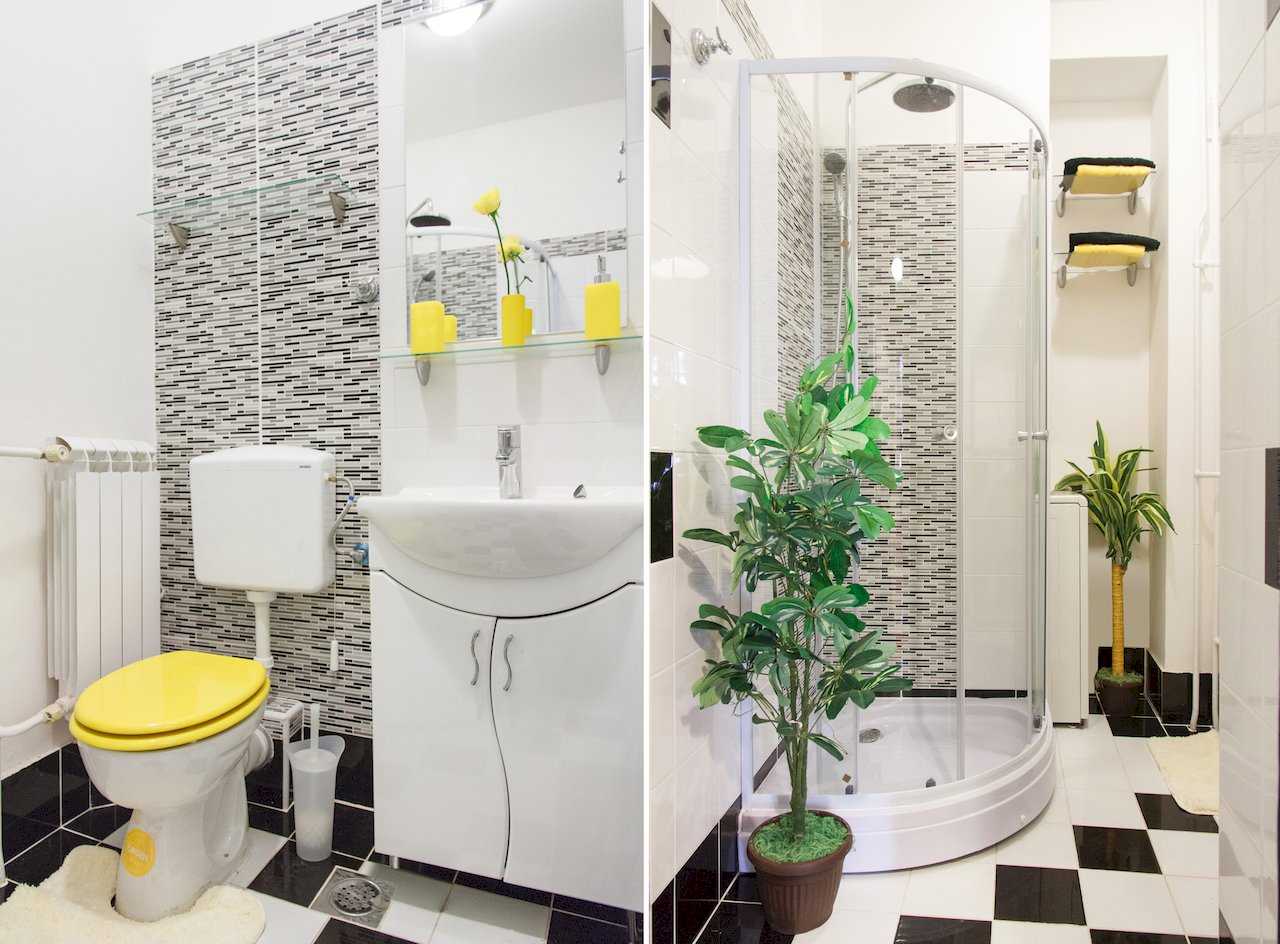 Apartman Sweet (Beograd, centar) – kupatilo sa tuš kabinom, šahovskim podom i žutim detaljima (dve fotografije)