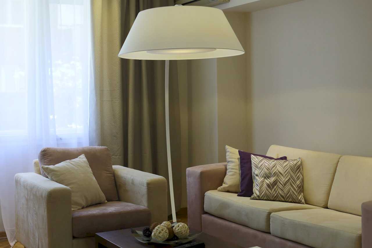 Apartment Taš 2 (King Alexander Boulevard, Tašmajdan, Belgrade) – living room corner with sofa, armchair, coffee table with decorative balls and floor lamp