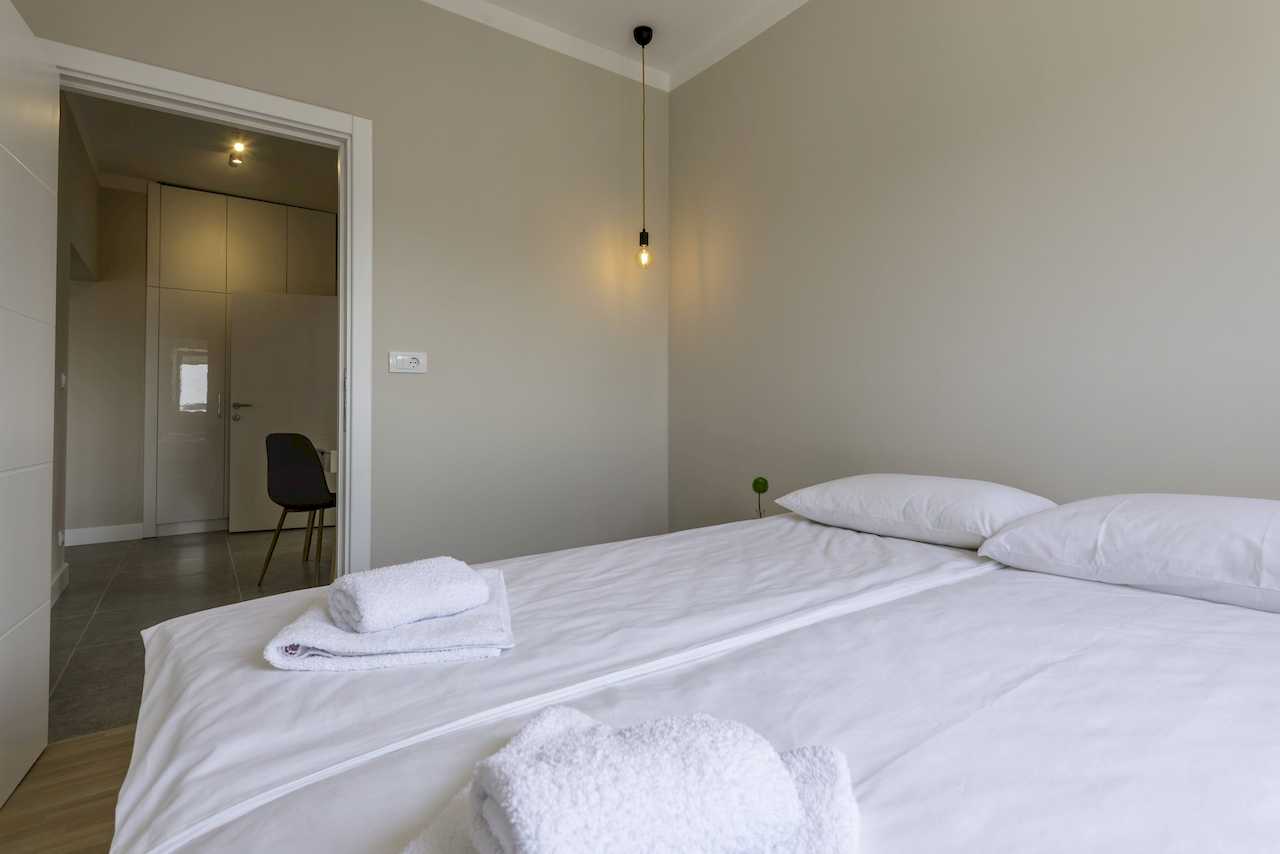 Fresh bed linen and towels detail – Apartment Urban Zen – City Break Apartments