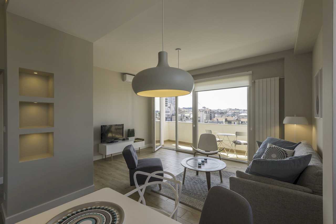 Living room with terrace access and city view – Apartment Urban Zen – City Break Apartments